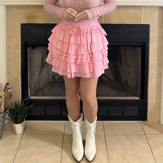 Pink Tiered Ruffle Mini Skirt is the epitome of feminine charm and playful style. Featuring an elastic waistband for a secure and adjustable fit.