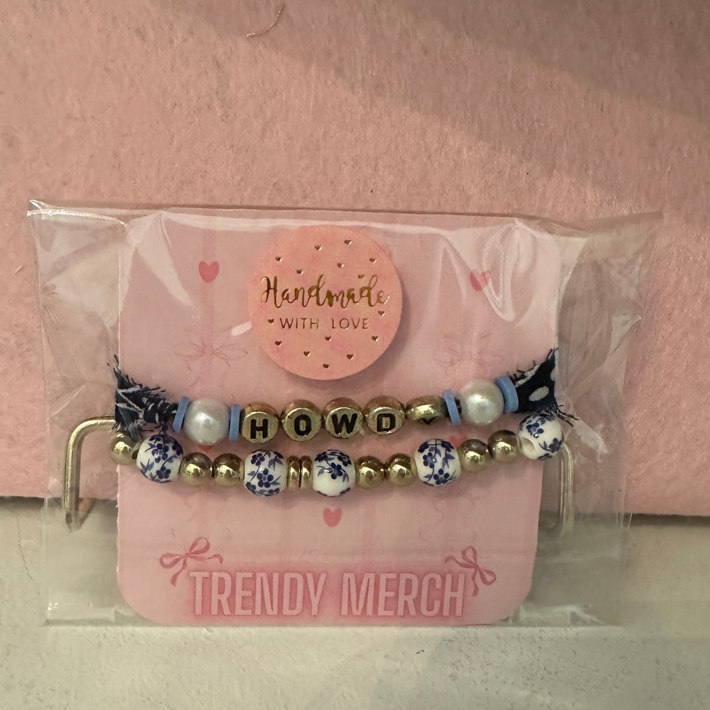 Set of beaded bracelets in a clear plastic packaging with 'Trendy Merch' branding on a pink background.