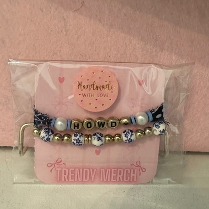Set of beaded bracelets in a clear plastic packaging with 'Trendy Merch' branding on a pink background.