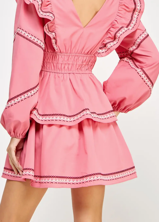 Ruffled Tiered Mini Dress is a charming and feminine piece that exudes elegance and playfulness. Designed with layered ruffles and intricate trim details.