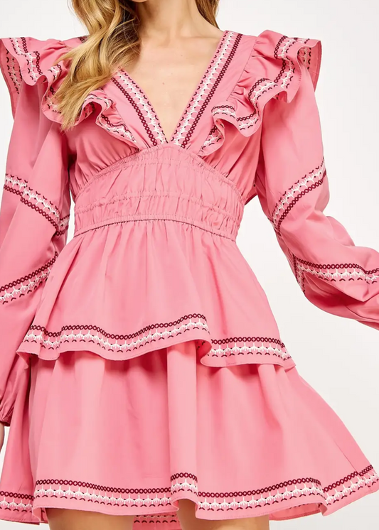 Ruffled Tiered Mini Dress is a charming and feminine piece that exudes elegance and playfulness. Designed with layered ruffles and intricate trim details.