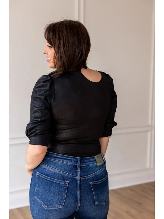  Black Puff Sleeve Bodysuit is a chic and versatile piece for any wardrobe. Featuring elegant puff sleeves, a sophisticated keyhole neckline. 
