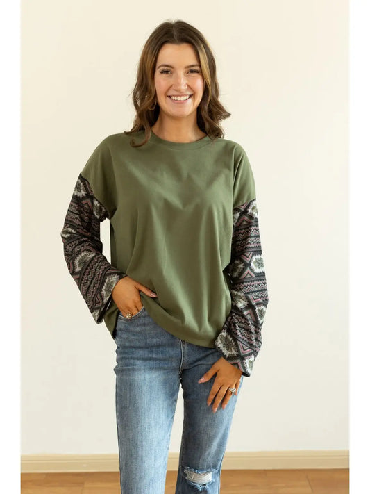 Aztec Sleeve Top is a stylish blend of simplicity and bold design. Featuring a solid olive-green.