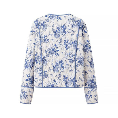 Blue  Floral Quilted Jacket is a timeless and elegant piece that offers both style and comfort. Featuring a classic blue-and-white floral pattern, this lightweight quilted jacket is perfect for layering during cooler seasons. 