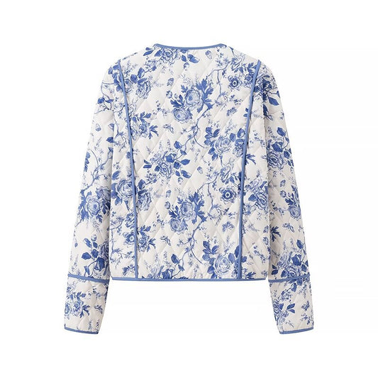 Blue  Floral Quilted Jacket is a timeless and elegant piece that offers both style and comfort. Featuring a classic blue-and-white floral pattern, this lightweight quilted jacket is perfect for layering during cooler seasons. 