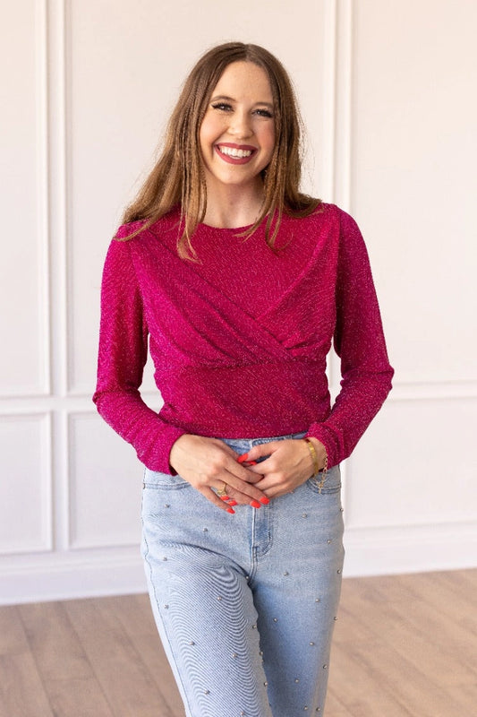 Hot Pink Sparkle Bodysuit brings a touch of elegance and shimmer to your wardrobe. Featuring a crew neck, high stretch fabric, and snap closure for easy wear. 
