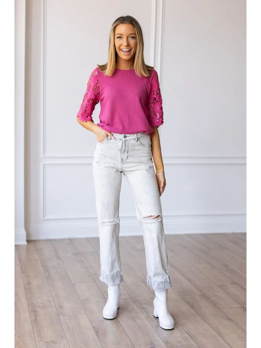 Lace Sleeve Top effortlessly combines comfort and elegance. Featuring a relaxed fit and delicate lace sleeves.