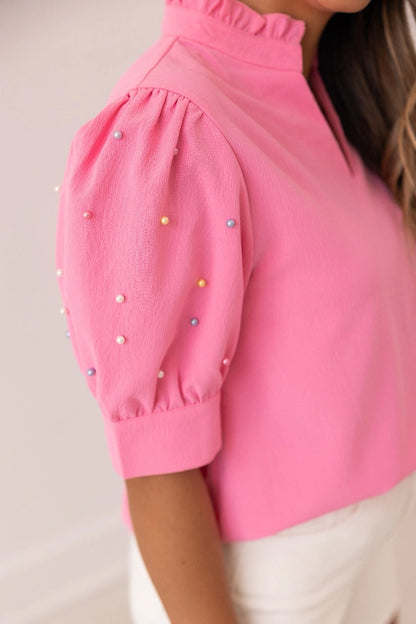Embellished Blouse is a playful yet sophisticated choice for any occasion. Featuring puff sleeves with delicate embellishments and a split neckline.