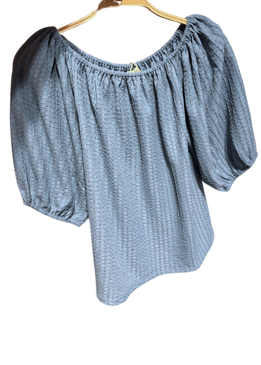 Textured Blouse. A gathered neckline, and airy three-quarter sleeves. 