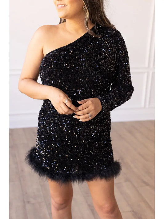 One-Shoulder Sequin Mini Dress. Featuring a fitted silhouette, dazzling black sequins, and a chic one-shoulder design.