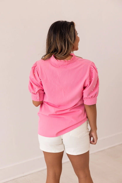 Embellished Blouse is a playful yet sophisticated choice for any occasion. Featuring puff sleeves with delicate embellishments and a split neckline.
