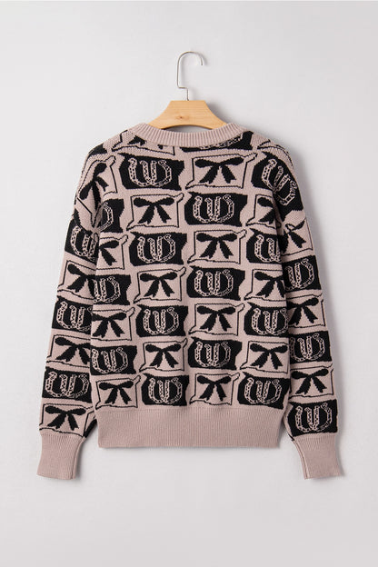 Western Print Sweater makes a bold statement with its unique bows and horseshoes pattern.