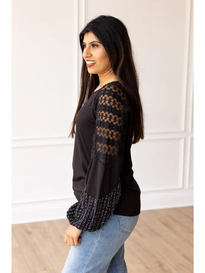  Lace Sleeve Top combines classic elegance with modern flair. This true-to-size top features intricate lace detailing on the sleeves and a softly flared cuff.