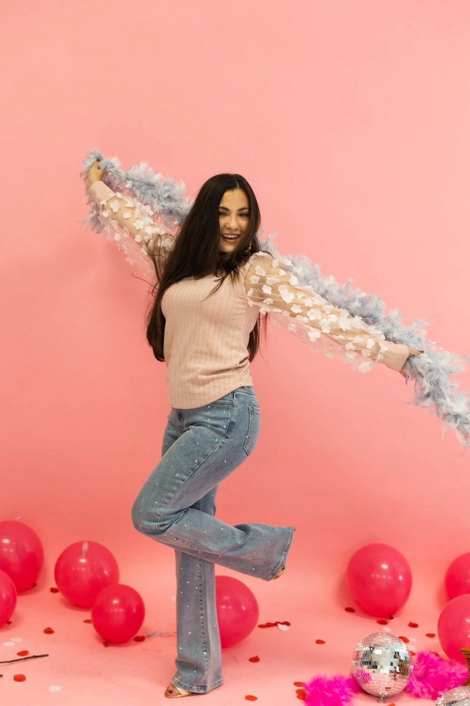 Floral Sleeve Top brings a touch of elegance and charm to your wardrobe. Designed with sheer puff sleeves adorned with 3D floral appliqués and a soft V-neckline.