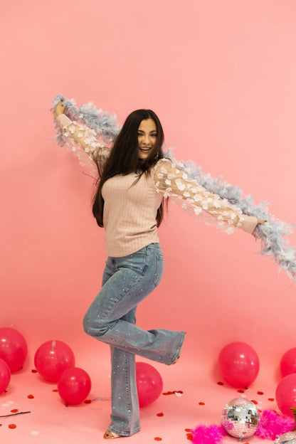 Floral Sleeve Top brings a touch of elegance and charm to your wardrobe. Designed with sheer puff sleeves adorned with 3D floral appliqués and a soft V-neckline.