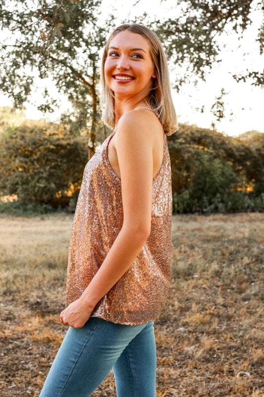 Rose Sequin Cami Top is a glamorous and eye-catching piece, perfect for special occasions or adding sparkle to your everyday look. Designed with a relaxed fit, this top features shimmering sequins throughout.
