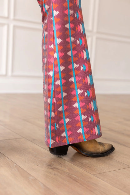 Aztec Flare Pants are a bold and stylish choice, designed to make a statement. These fitted pants feature a vibrant Aztec-inspired pattern and a flattering flared silhouette.