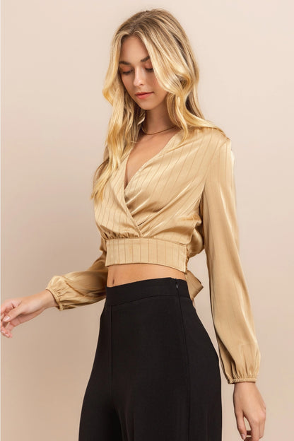 Beige Wrap Crop Top Made from lightweight polyester, this top features a flattering wrap design with a deep V-neckline and long sleeves.