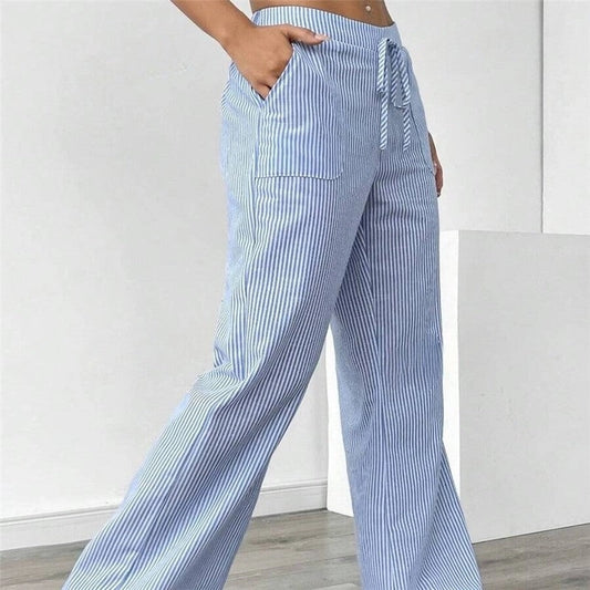 Striped Drawstring Wide-Leg Pants offer a perfect blend of comfort and style. These pants are designed for effortless wear. Featuring an elastic waistband with a drawstring.