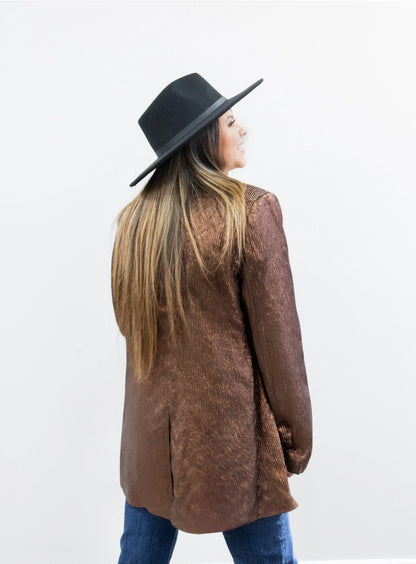 Metallic Blazer is a bold statement piece that effortlessly blends sophistication and glamour. Featuring a sleek metallic sheen, a lined interior, and functional pockets.