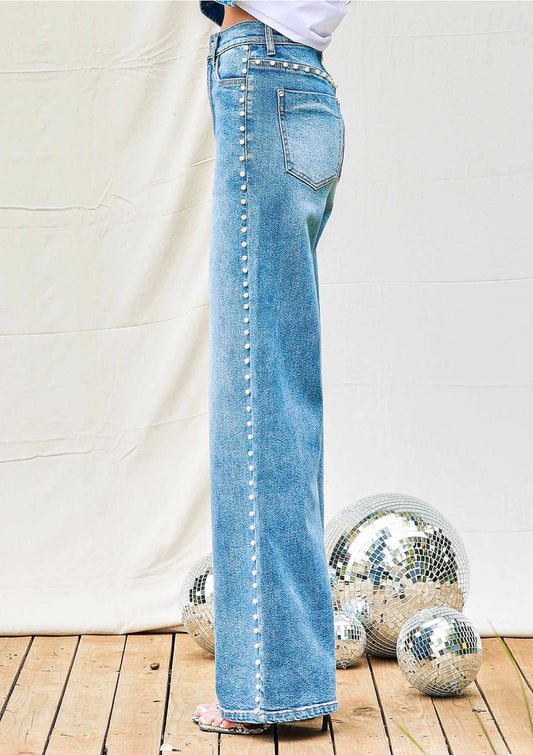  Pearl-Detail High-Rise Wide-Leg Jeans are a sophisticated twist on a classic denim style. These high-rise jeans feature a wide-leg silhouette.