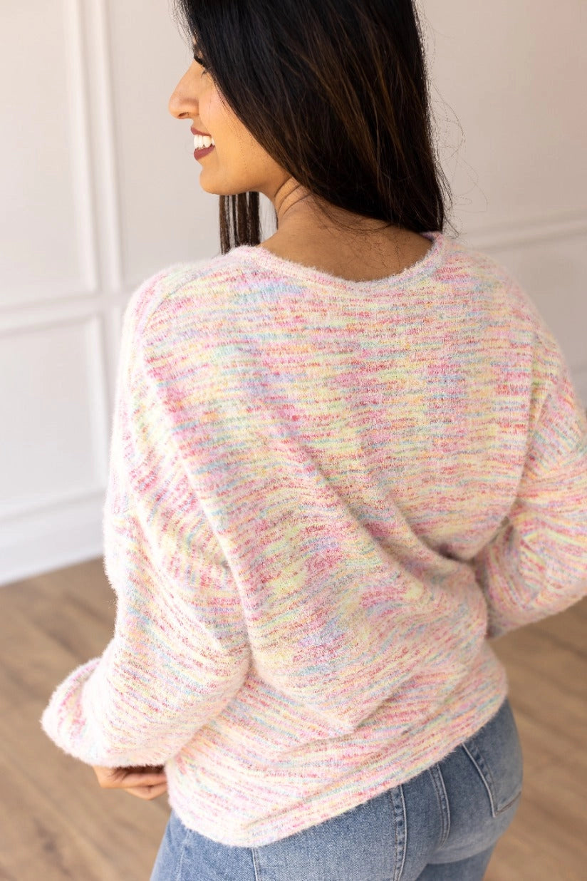 A multicolor Knit Top adds a vibrant, playful touch to your wardrobe. Crafted from a soft and stretchy blend, this top offers all-day comfort. Featuring a relaxed fit and a beautiful heathered multicolor knit design.