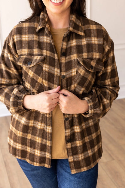 Oversized Plaid Shacket is the ultimate blend of comfort and style. Featuring a classic plaid pattern and an oversized fit.