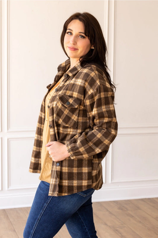 Oversized Plaid Shacket is the ultimate blend of comfort and style. Featuring a classic plaid pattern and an oversized fit.
