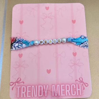 Peace Floral Fabric Word Bracelet on Trendy Merch display card