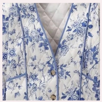 Trendy Merch blue and white floral quilted jacket with V-neck, button front, and piping detail. 80% Polyester, 20% Cotton.