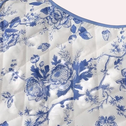 Trendy Merch blue and white floral quilted jacket with piping detail. Polyester and cotton blend.