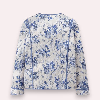 Trendy Merch blue and white floral quilted jacket with piping detail, polyester-cotton blend.