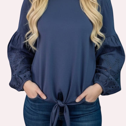 Trendy Merch slate blue cotton tie-front top with eyelet detail on puffed sleeves.
